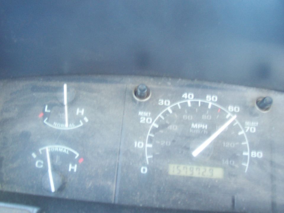 Truck gauge cluster with needle past 60 MPH and odometer near 159,992 miles