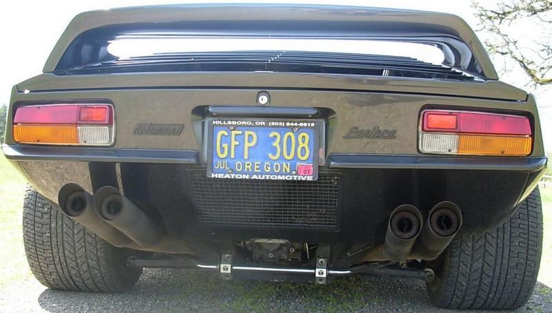 Rear of dark DeTomaso Pantera with quad exhausts and Oregon plate