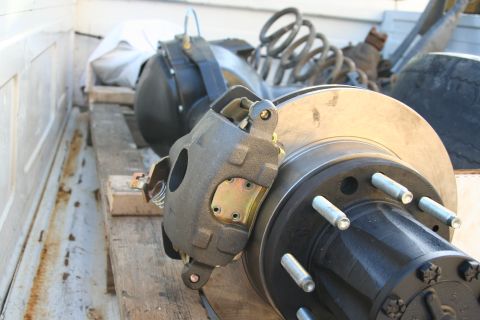 1992 Ford Bronco - Rear axle assembly with disc brake components, likely for a truck or SUV, is shown in a truck bed.