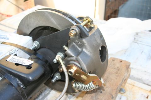 1992 Ford Bronco - A close-up view of a vehicle's rear disc brake assembly, including the rotor and caliper.