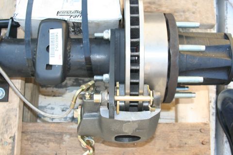 1992 Ford Bronco - Close-up of a rear disc brake assembly, likely a replacement part.