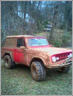1969 Ford Bronco - This 1969 Ford Bronco is covered in mud, suggesting it has been off-roading.