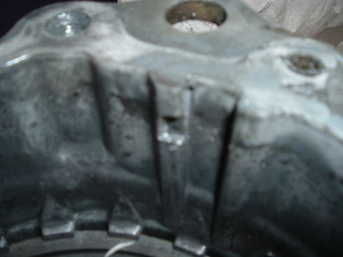 1989 Ford Bronco - Metal transfer case housing with visible casting details and some wear.
