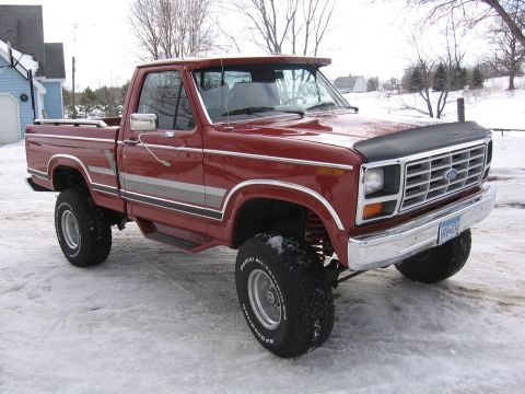 1984 Ford F-150 - This lifted Ford pickup truck displays a grille consistent with the early 1980s model years.
