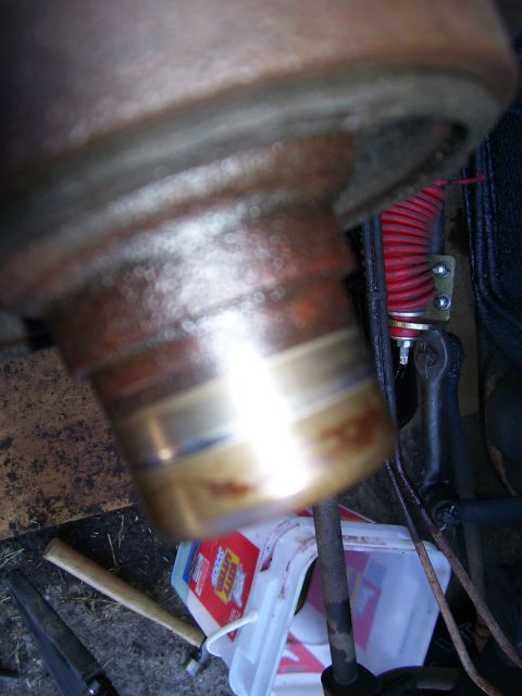 1984 Ford Bronco - Close-up of a metal automotive part, possibly a suspension component.