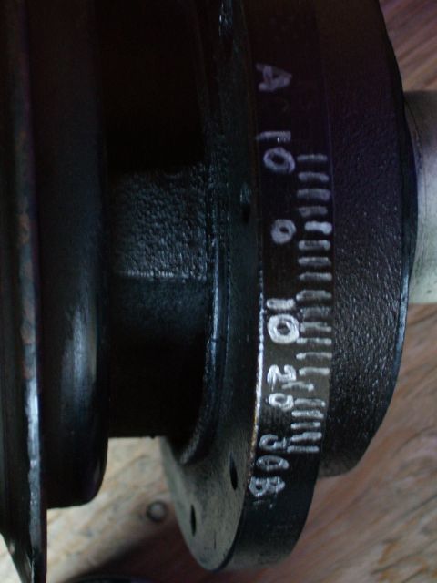 1984 Ford Bronco - This image shows a crankshaft with painted timing marks and numerical indicators for engine timing adjustments.