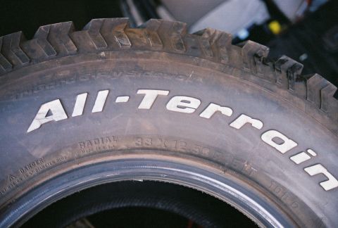 1981 Ford Bronco - A BFGoodrich All-Terrain tire is shown, with visible sidewall markings and tread detail.