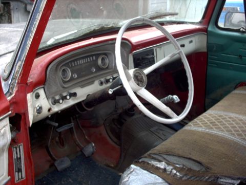 1965 Ford F-100 - The interior of a 1965 Ford F-100 truck, viewed from the passenger side.