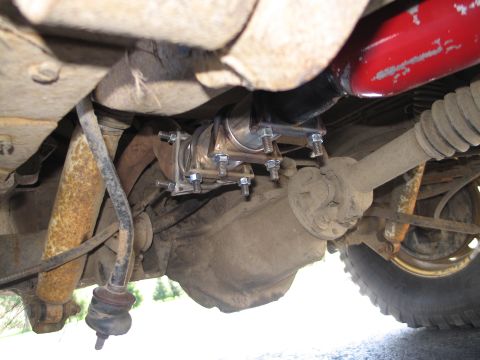 1995 Ford Bronco - Custom exhaust pipe connection installed on a vehicle's undercarriage.