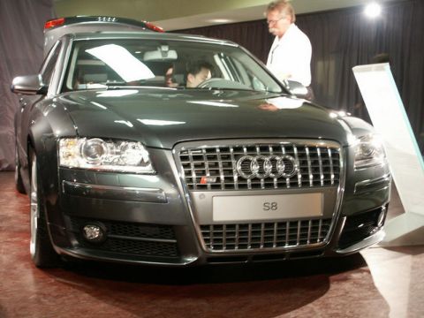 2001 Mercury Grand Marquis - This Audi S8 is displayed at an event, with a man standing behind it and another person inside.