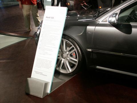 2001 Mercury Grand Marquis - Audi S8 displayed with a sign listing its specifications and features.