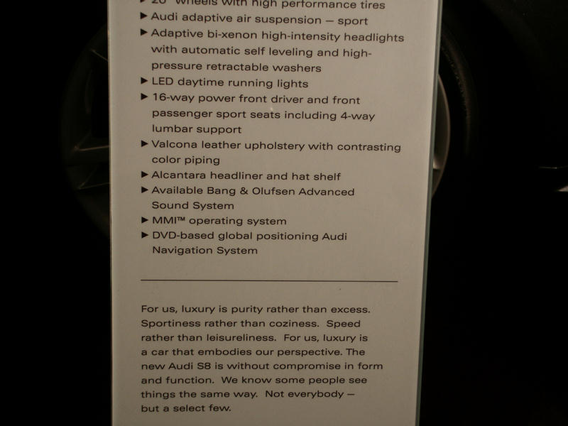 Lower Audi S8 spec card with feature list and marketing prose