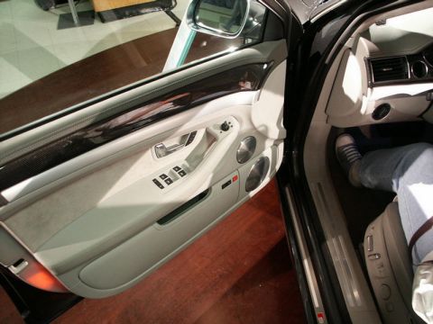 2001 Mercury Grand Marquis - Interior view of a car's driver side door and dashboard, with a person visible in the driver's seat.