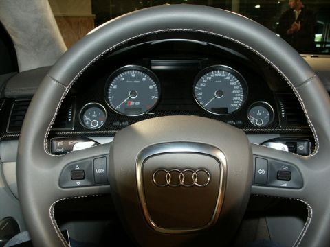 2001 Mercury Grand Marquis - The interior of an Audi S8 shows the steering wheel, instrument cluster, and carbon fiber trim.