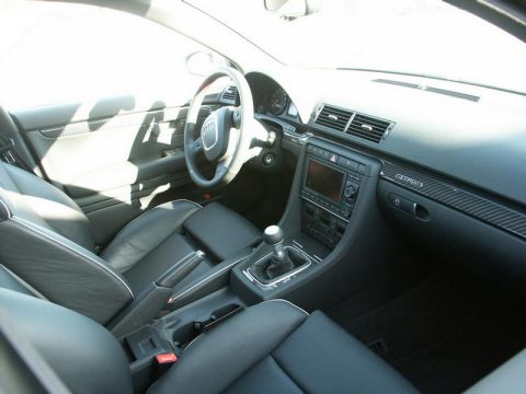 2001 Mercury Grand Marquis - Interior view of a car showing the dashboard, seats, and manual transmission shifter.