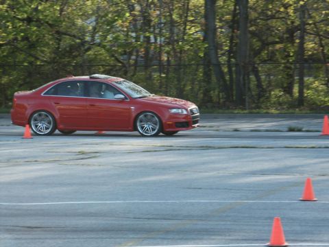 2001 Mercury Grand Marquis - Red Audi A4 sedan navigates a course marked by orange cones.