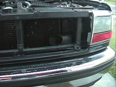 1994 Ford Bronco - Close-up view of the front grille and radiator of a 1994 Ford Bronco.