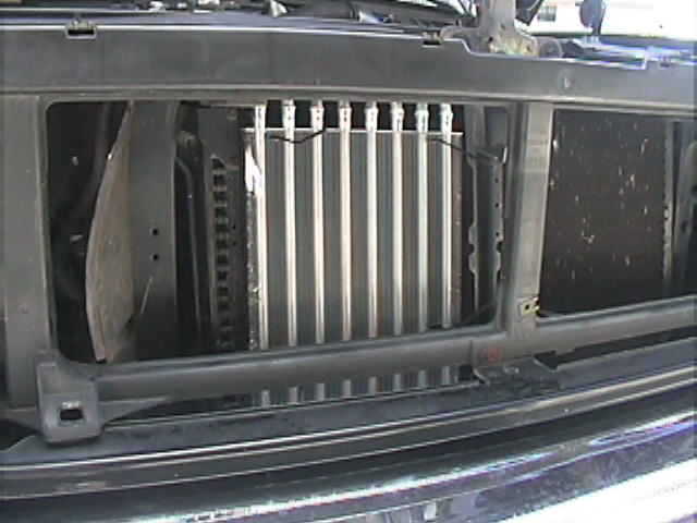Auxiliary tube-and-fin cooler mounted ahead of radiator, grille removed