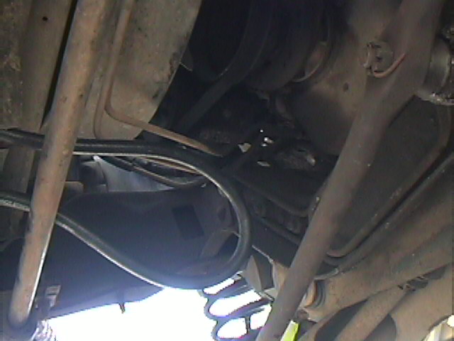 Undercarriage view of a vehicle's frame, driveshaft and suspension