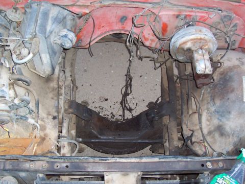 1981 Ford F-150 - Engine bay of a 1981 Ford F-150, showing the brake booster and red painted firewall.