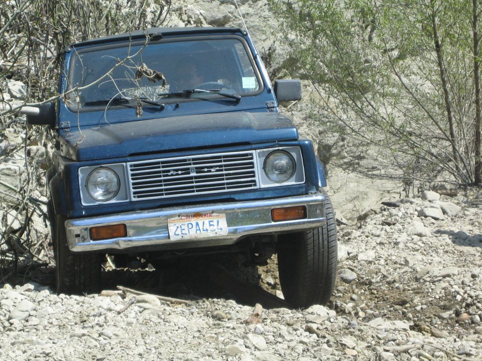 1987 Suzuki Samurai on a rocky, off-road trail