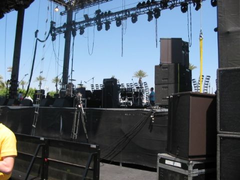 1991 Ford Bronco - A large outdoor stage is prepared for a performance with extensive sound and lighting equipment.