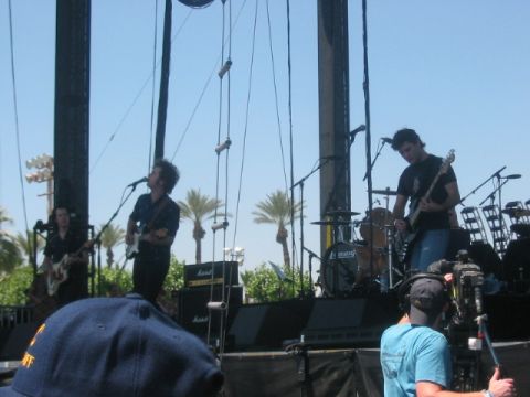 1991 Ford Bronco - A band plays on an outdoor stage under a clear blue sky.