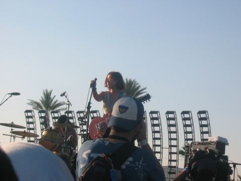 1991 Ford Bronco - A live music performance takes place outdoors under a clear blue sky.