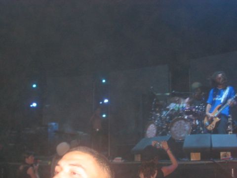 1991 Ford Bronco - A band performs live on stage with a drummer and guitarists, illuminated by stage lights.