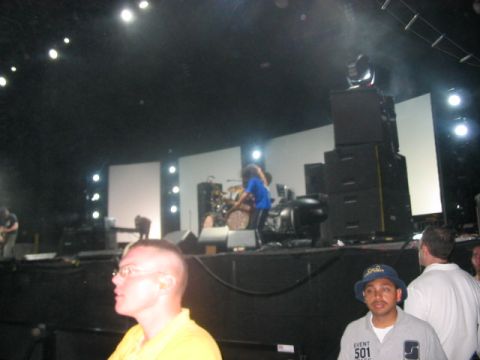 1991 Ford Bronco - A band performs on stage during a concert, with audience members visible in the foreground.