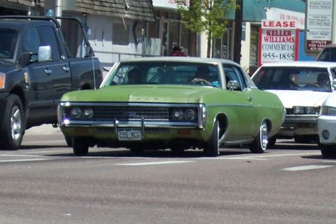 1972 Ford Ranchero - This green 1971 Chevrolet Caprice sedan features a distinctive front grille and custom wheels.