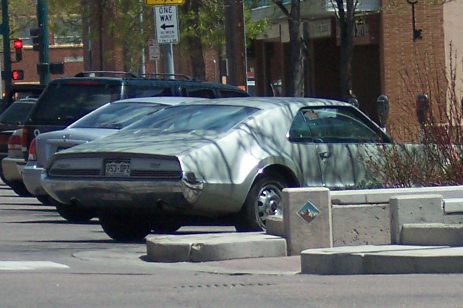 1970 Oldsmobile Toronado parked on street, rear view. License plate 953-DPZ