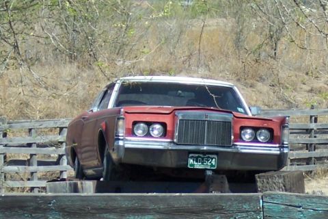 1972 Ford Ranchero - This 1972 Lincoln Continental Mark IV features a distinctive grille and dual headlights, with a white vinyl roof.