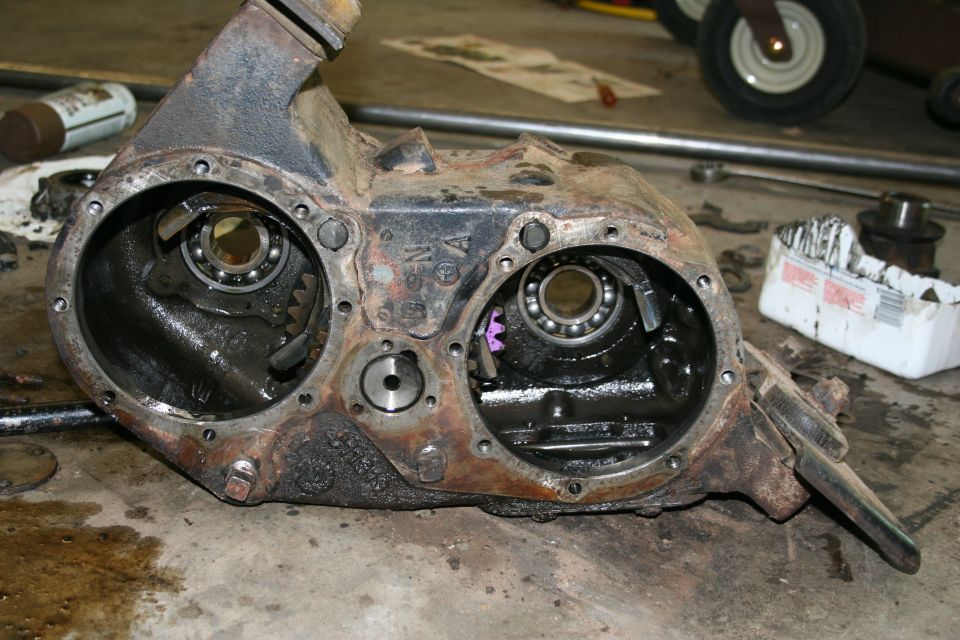 Gutted NP205. Center drive gears and shifter forks still installed.