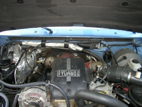 1995 Ford Bronco - The engine bay of a 1995 Ford Bronco is visible, the diesel turbo engine.