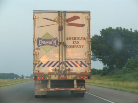 1988 Ford E250 - Rear view of a trailer for Emerson Fan Company, their logo and a graphic of a ceiling fan.
