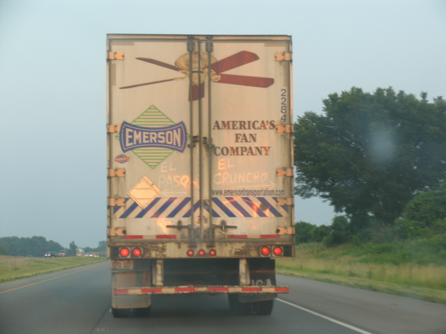 Rear doors of an Emerson America's Fan Company semi trailer on a highway