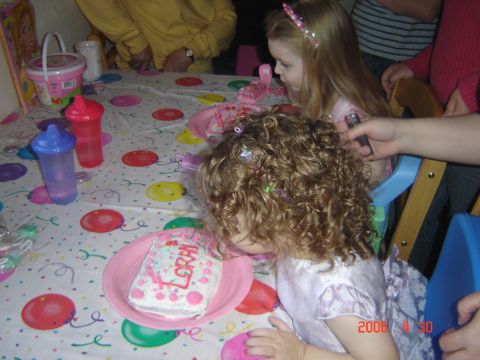1993 Ford Bronco - Children celebrate a birthday party with a cake and drinks on a table covered with a festive tablecloth.
