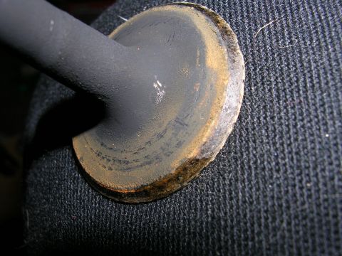 1996 Ford Probe - Engine valve showing signs of wear and carbon deposits on its sealing surface.