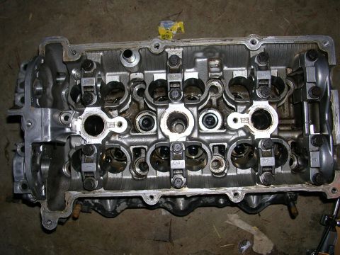1996 Ford Probe - Close-up view of a disassembled engine cylinder head, showing internal components.