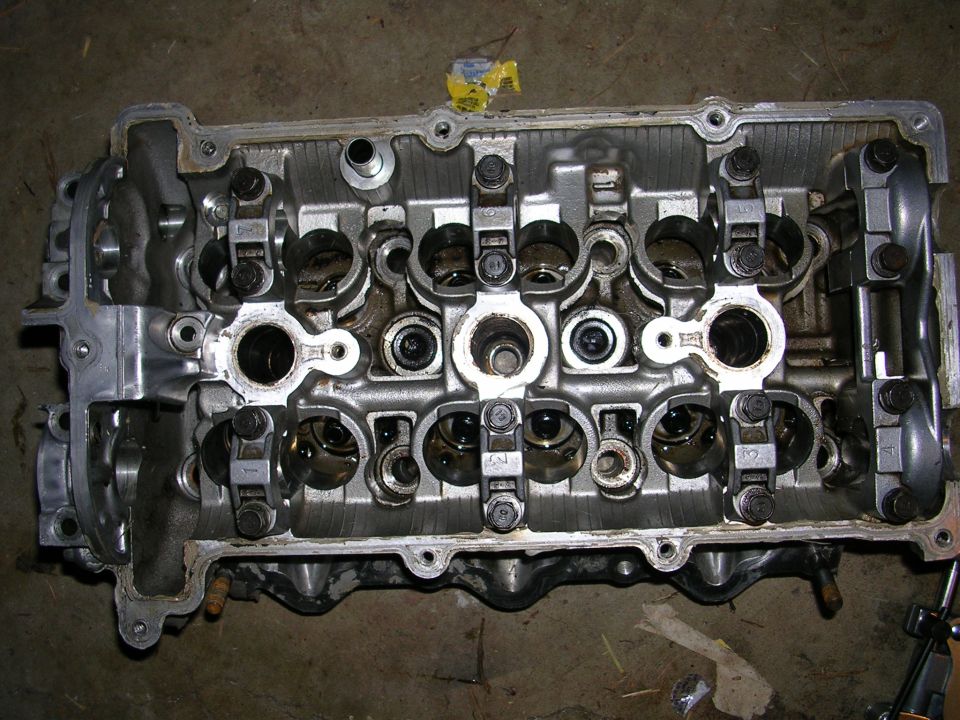 Engine cylinder head with valves and camshafts visible