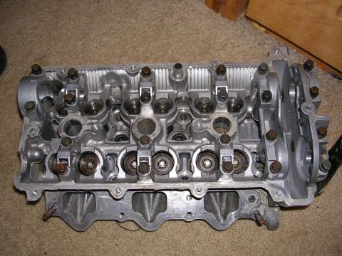 1996 Ford Probe - A close-up view of an engine cylinder head, showing its internal components.