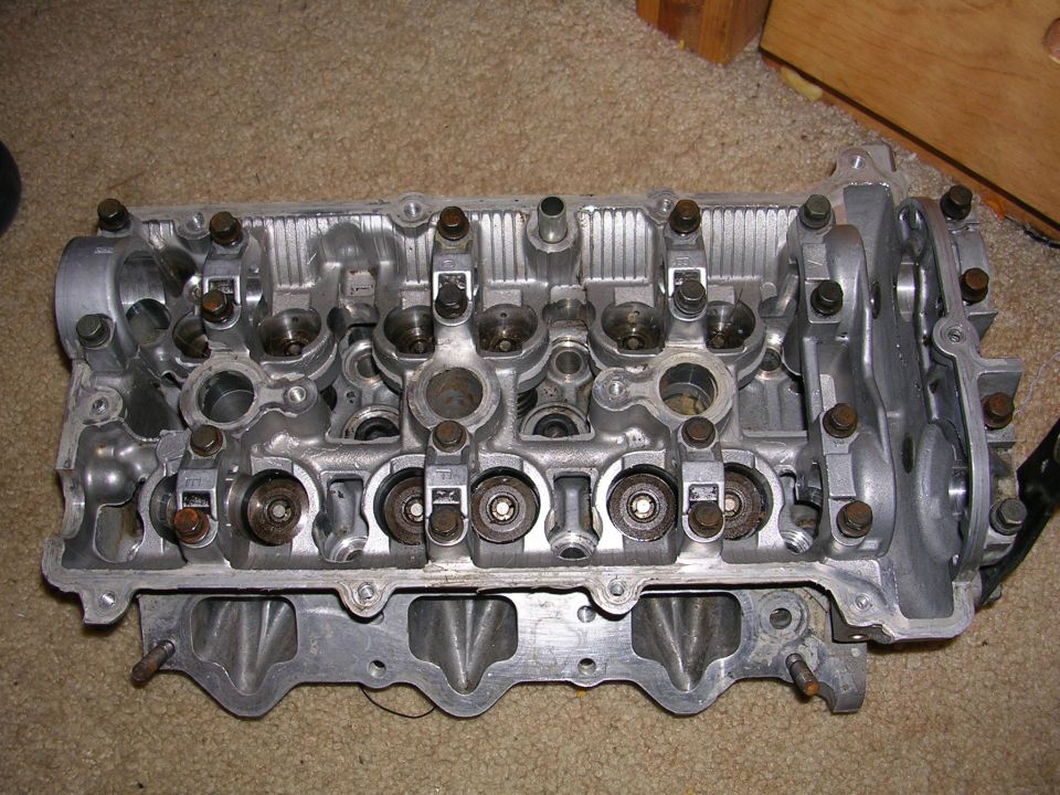 Engine cylinder head with visible valves and rocker arms