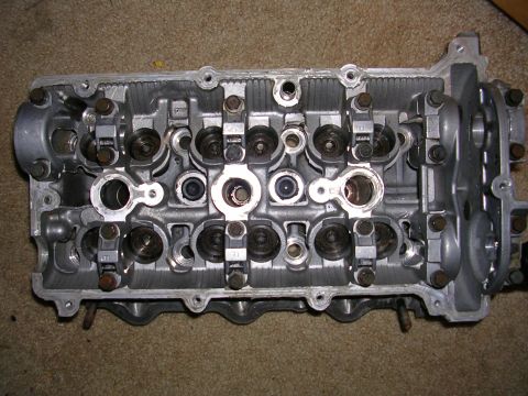 1996 Ford Probe - Close-up of an engine cylinder head, showing internal components.