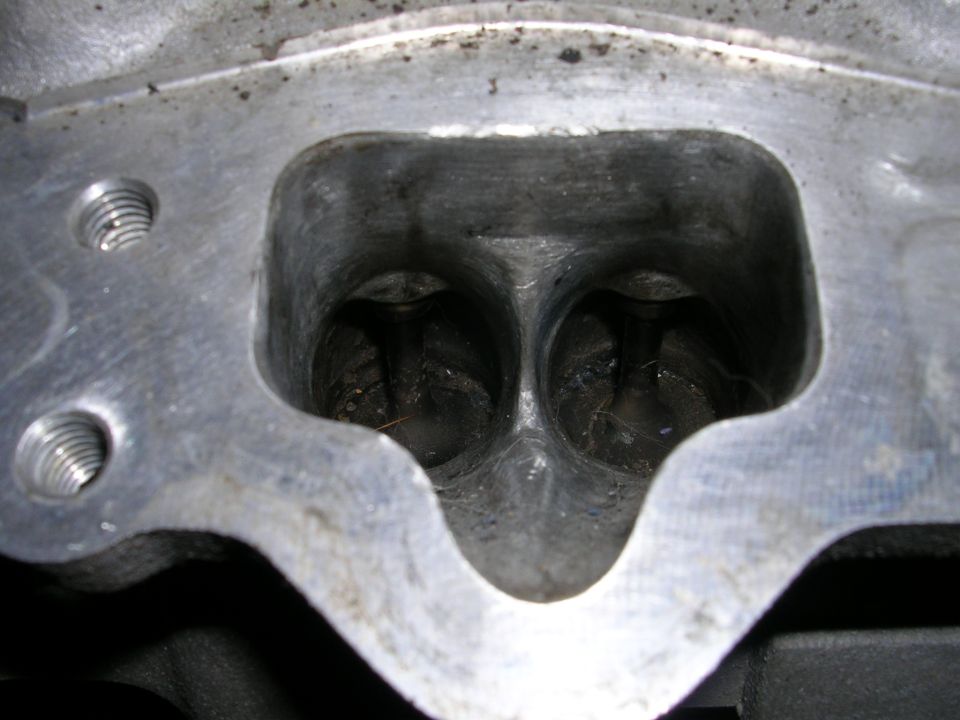 Close-up of an engine cylinder head with two intake ports visible