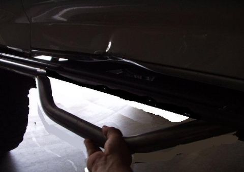 1983 Ford Bronco - Installing a side step bar on a vehicle's rocker panel.