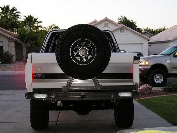 White 1983 Ford Bronco rear view with spare tire mounted