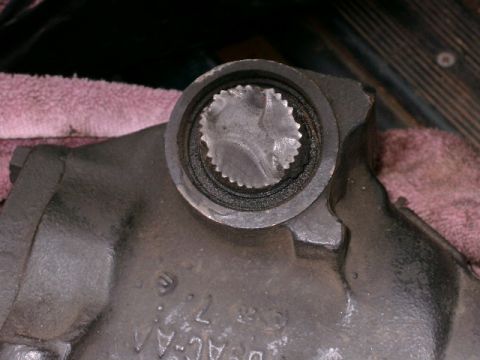 1996 Ford Bronco - Damaged splined shaft in a metal housing, possibly from a vehicle drivetrain component.