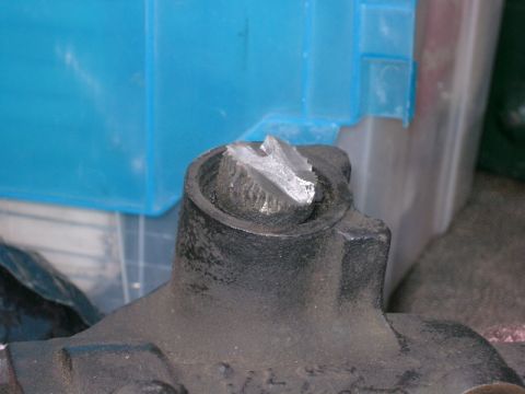 1996 Ford Bronco - A close-up view of a damaged metal component, showing signs of significant breakage.