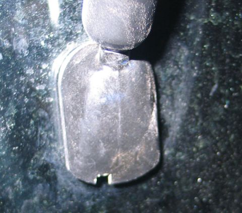 1994 Ford Bronco - The mounting bracket for a vehicle's side mirror is shown in this close-up detail shot.